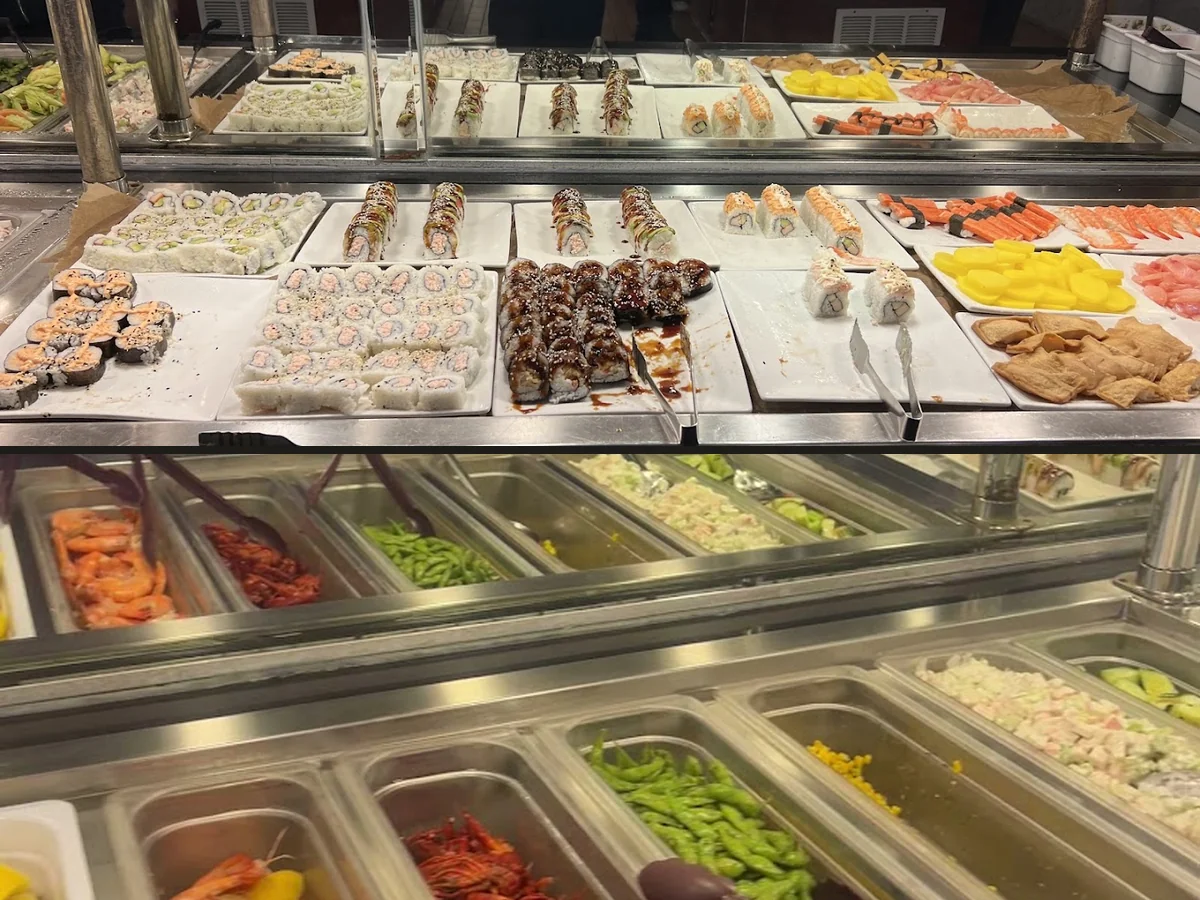 Buffet trays lined with hot Chinese dishes.