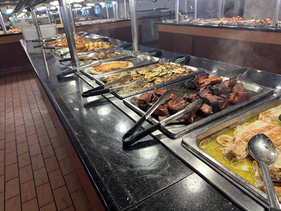 Salad bar with chilled bowls and fresh greens.