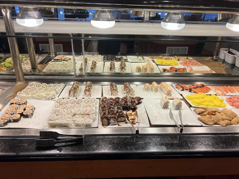Dessert section with fruit and sweet plates.
