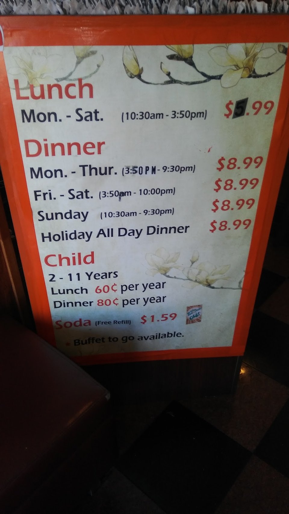 Sushi and hot dishes on a menu display.